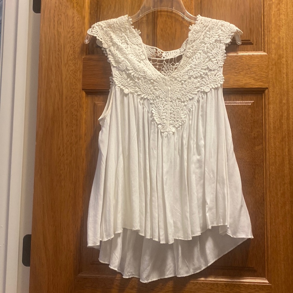 White sleeveless blouse